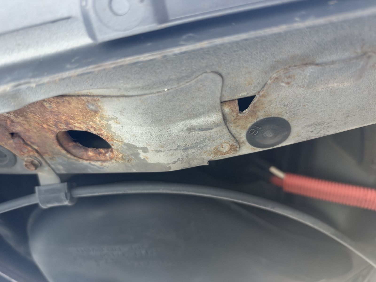 Another rusty section of the underside of the same car